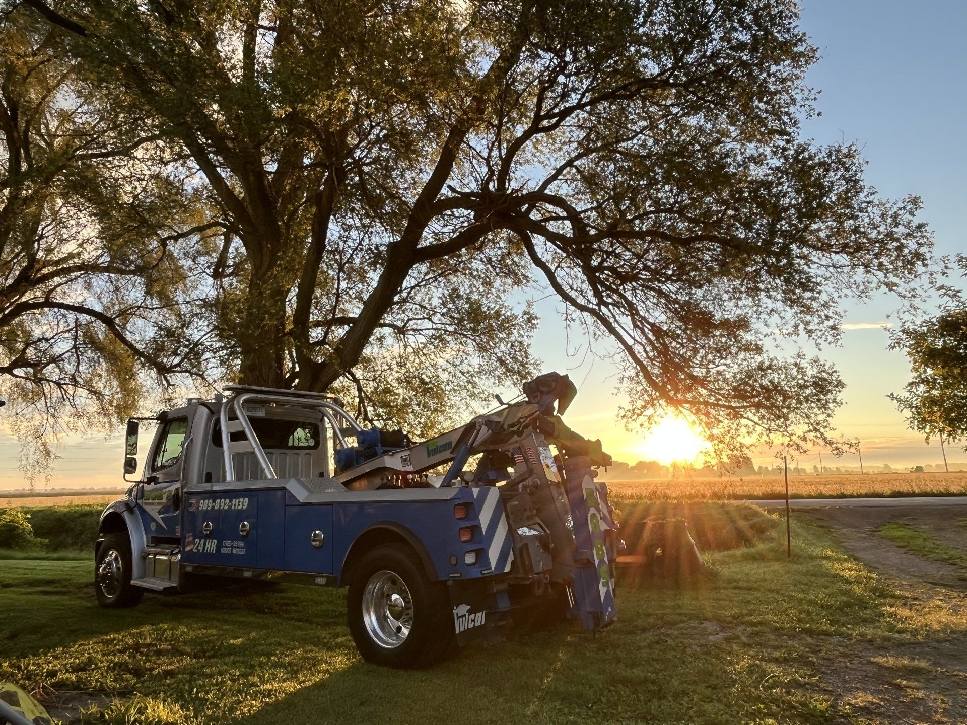 Towing  truck under the tree