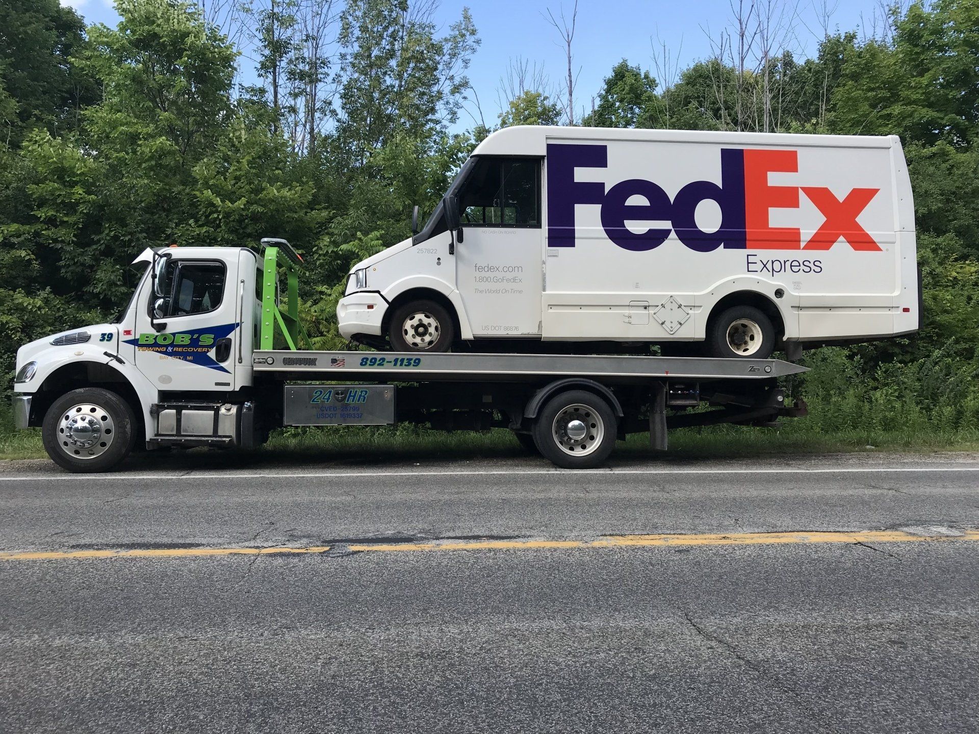 FedEx truck being towed