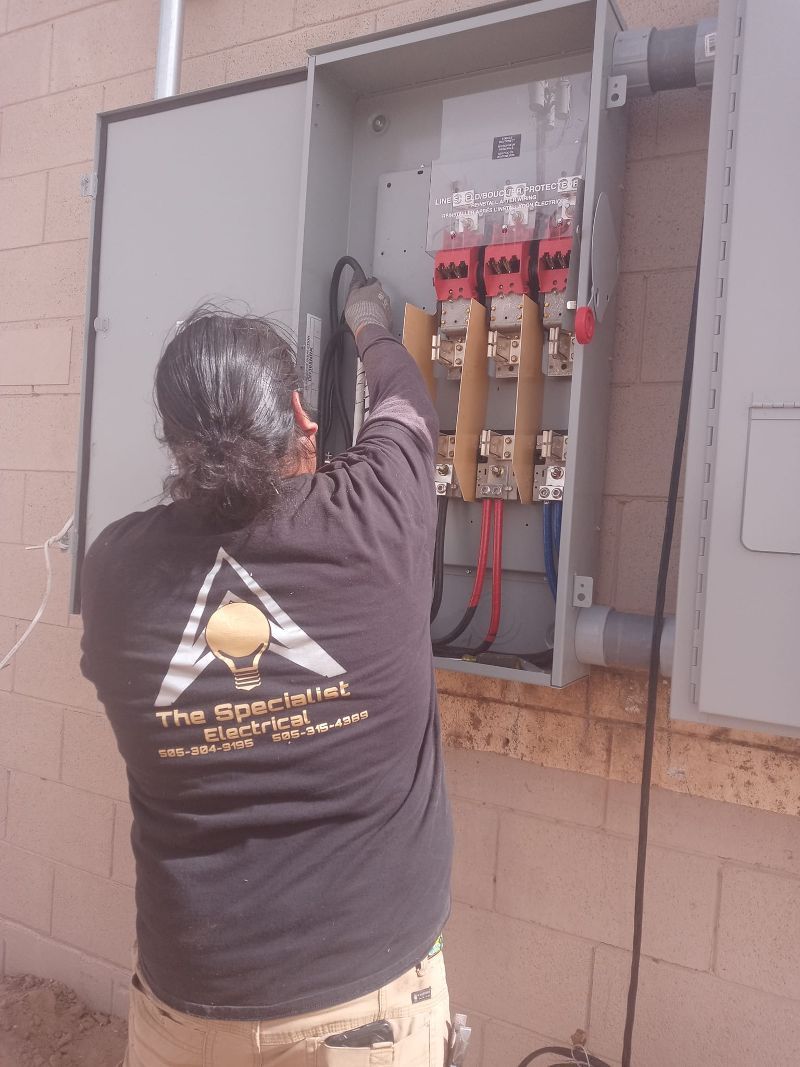 A man wearing a black shirt that says 