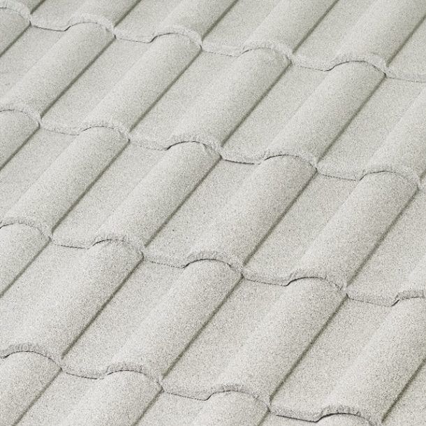 Close-up of a textured, light gray roof made of overlapping, curved tiles.