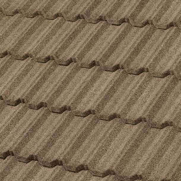 Close-up of a brown, textured metal roof with a scalloped pattern.