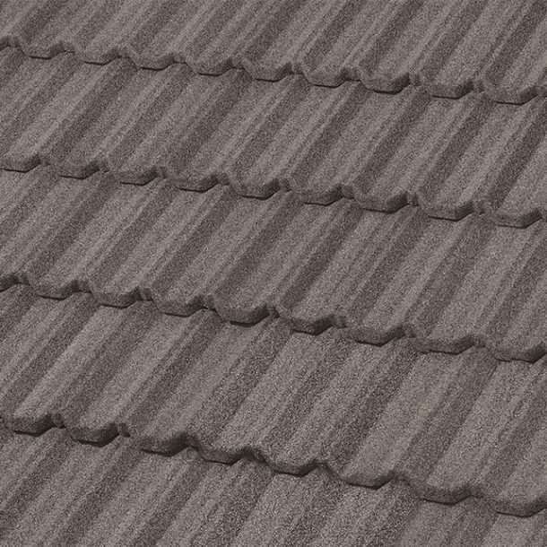 Close-up of a section of a roof covered in dark gray metal tiles with a textured, striped pattern.