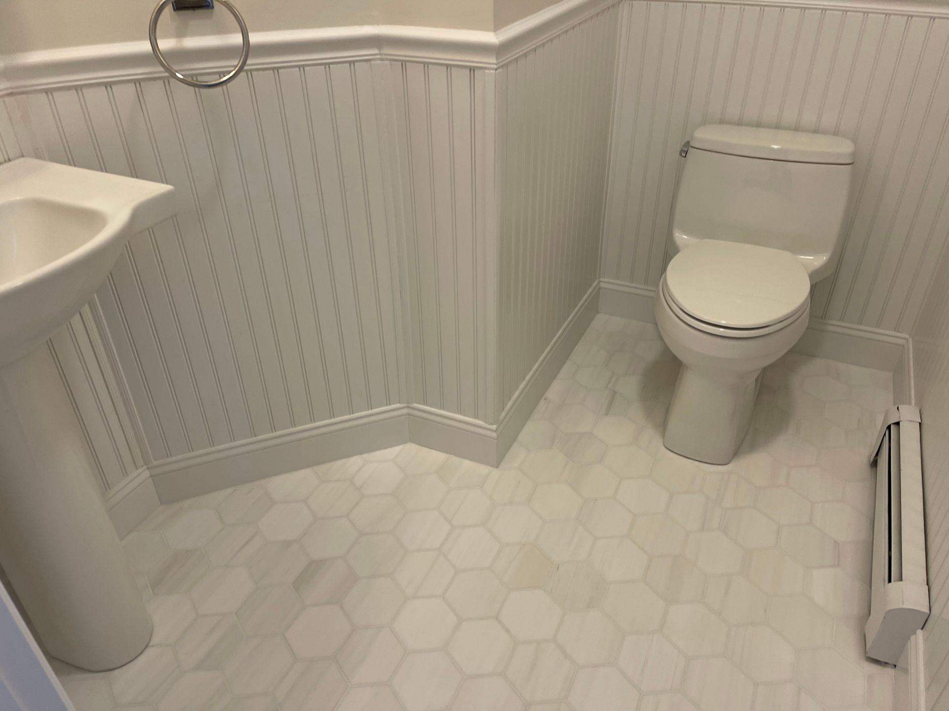 There is a toilet and a sink in the bathroom.