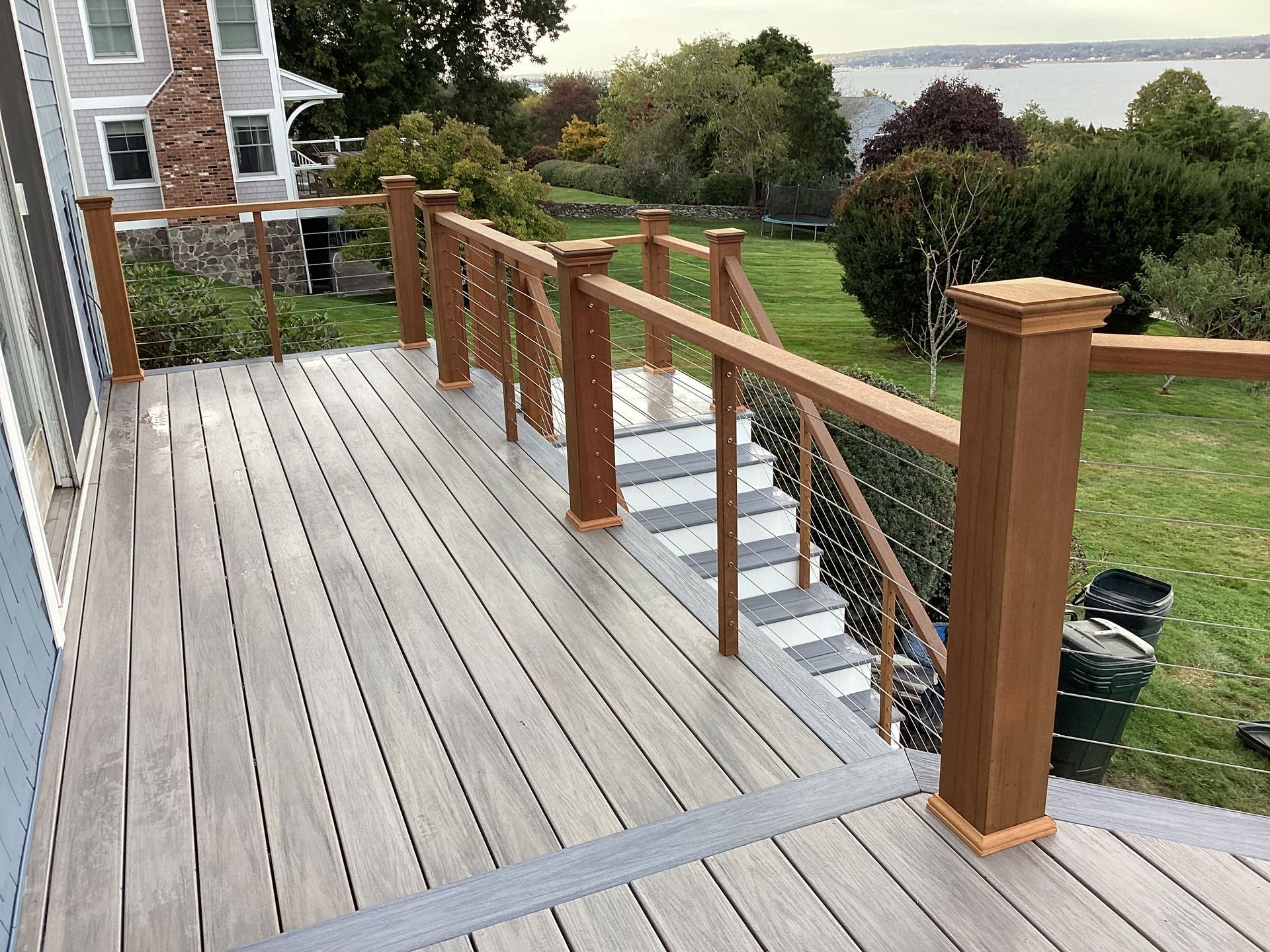 A wooden deck with stairs leading up to it.