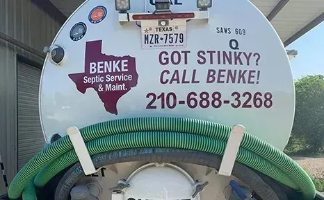 A white septic tank truck