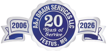A&J Drain Services LLC logo: Blue and white emblem celebrating 20 years of service, with dates 2006 and 2026, Festus, MO.