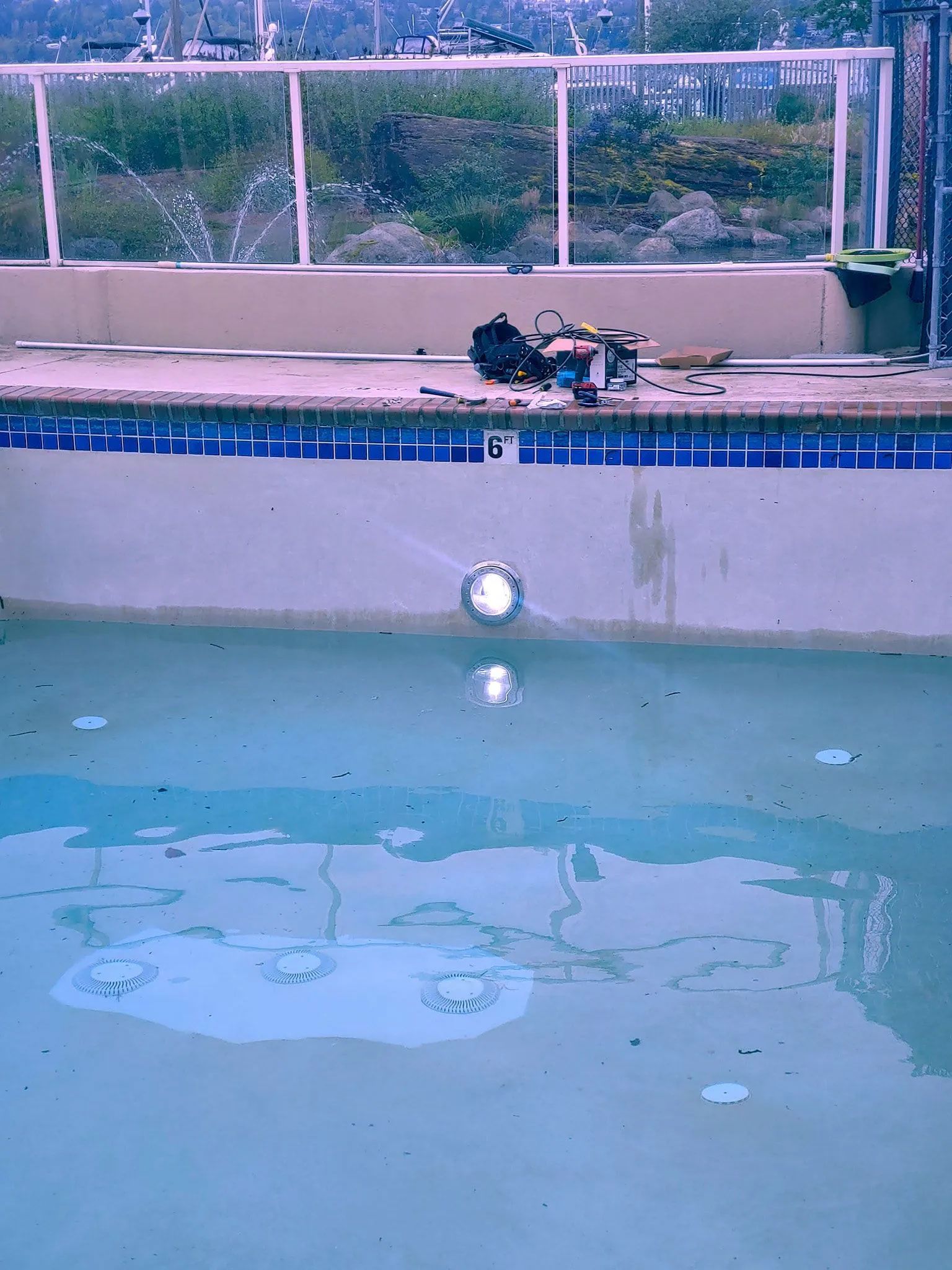 Living room with couch, open doorway to dining area with table, and a decorative panel on the right.