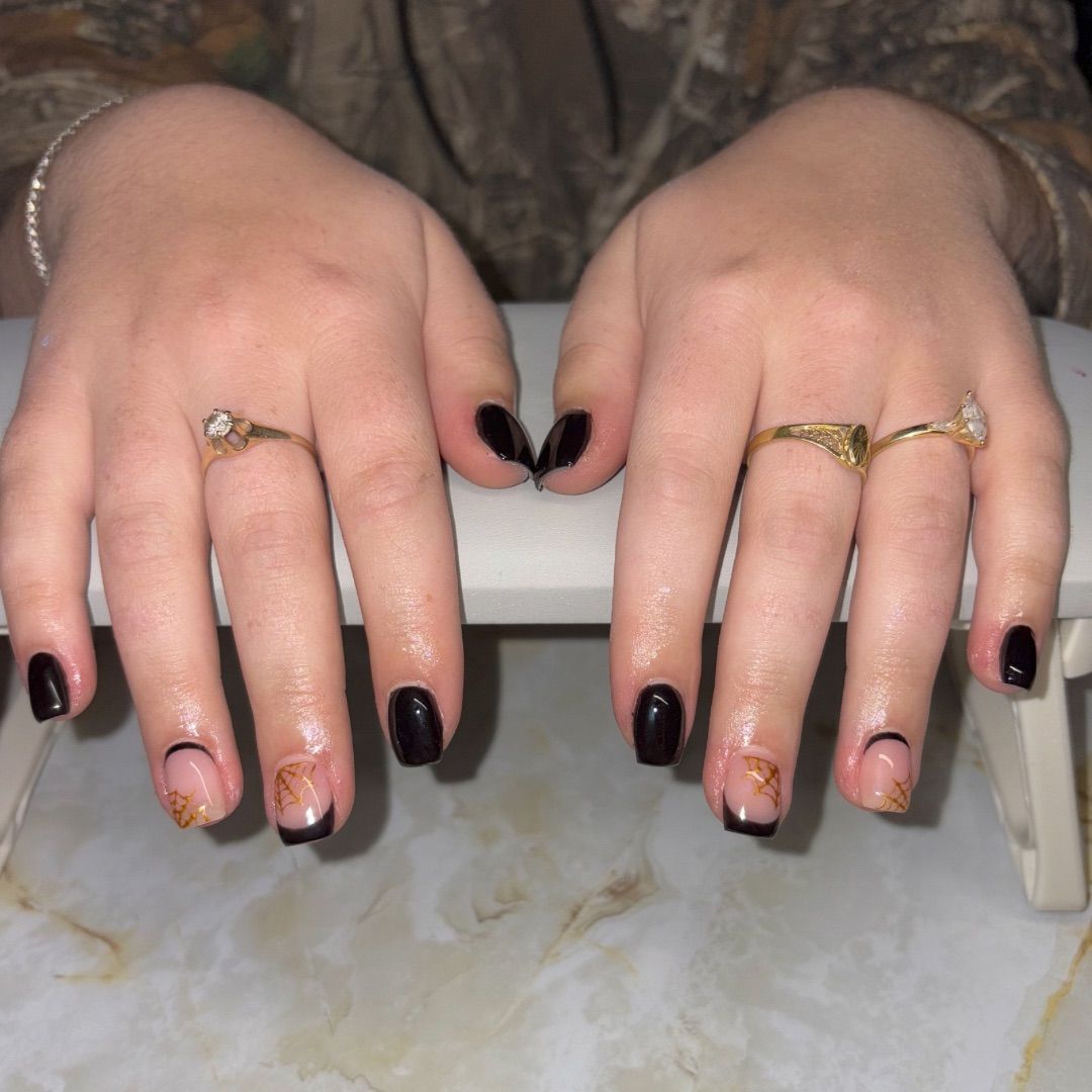 A close up of a woman 's hands with rings on them