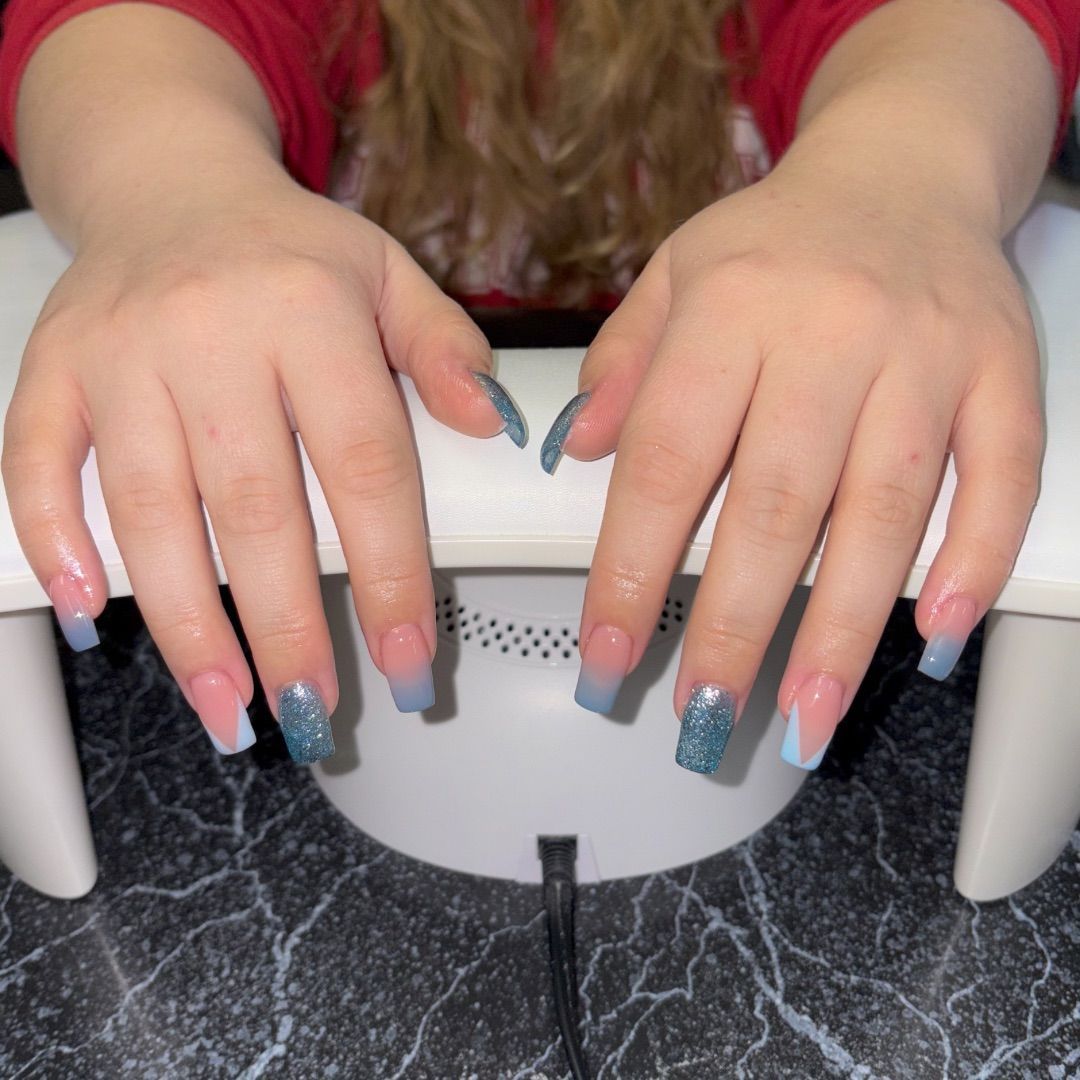 A woman's hands with a baby blue design.