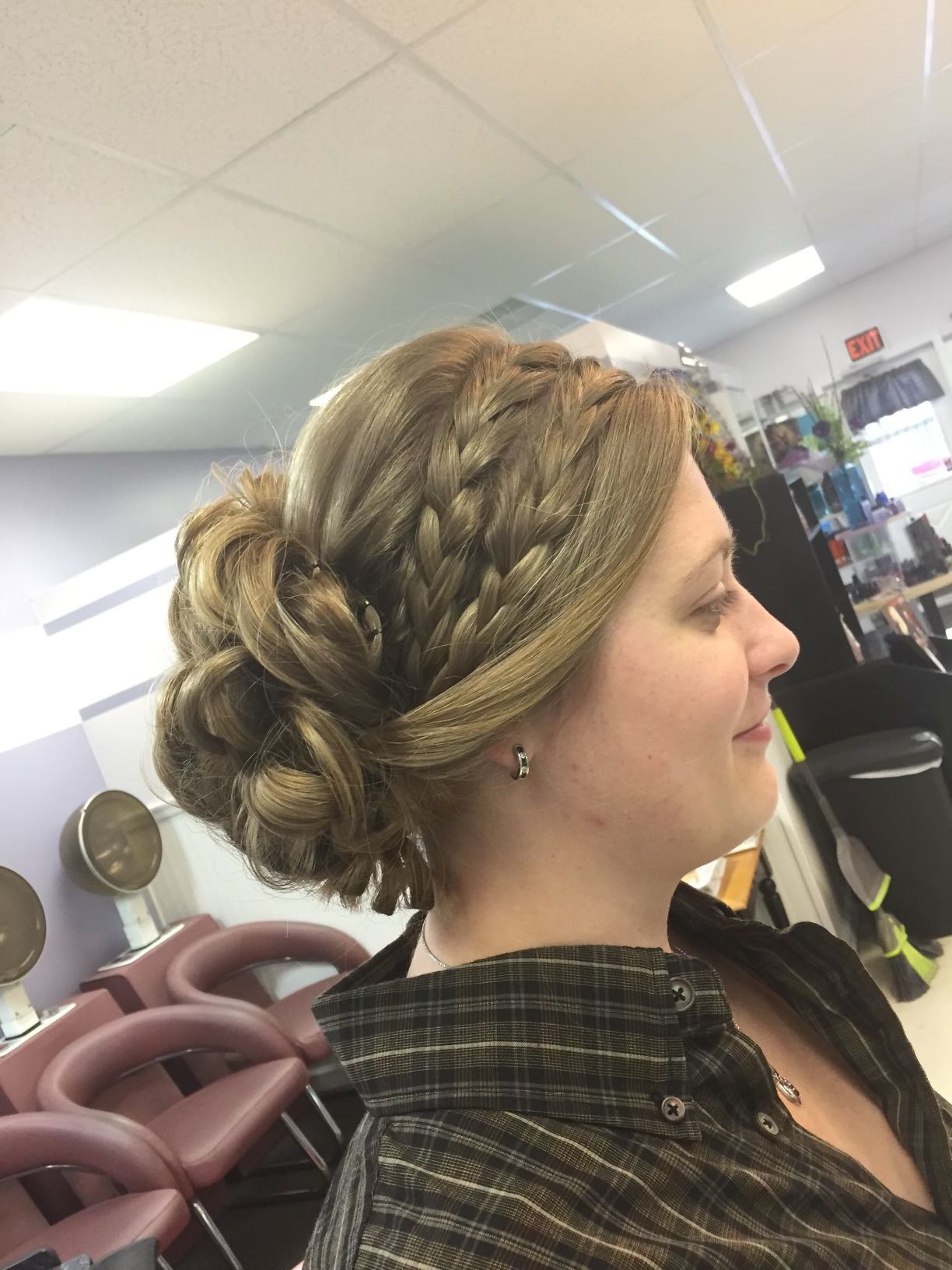 A woman is getting her hair done in a salon.