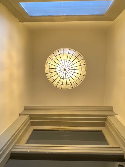 Looking up at a ceiling with a light in the middle