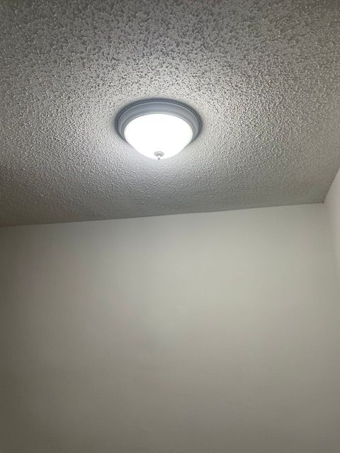 There is a light on the ceiling of a room.