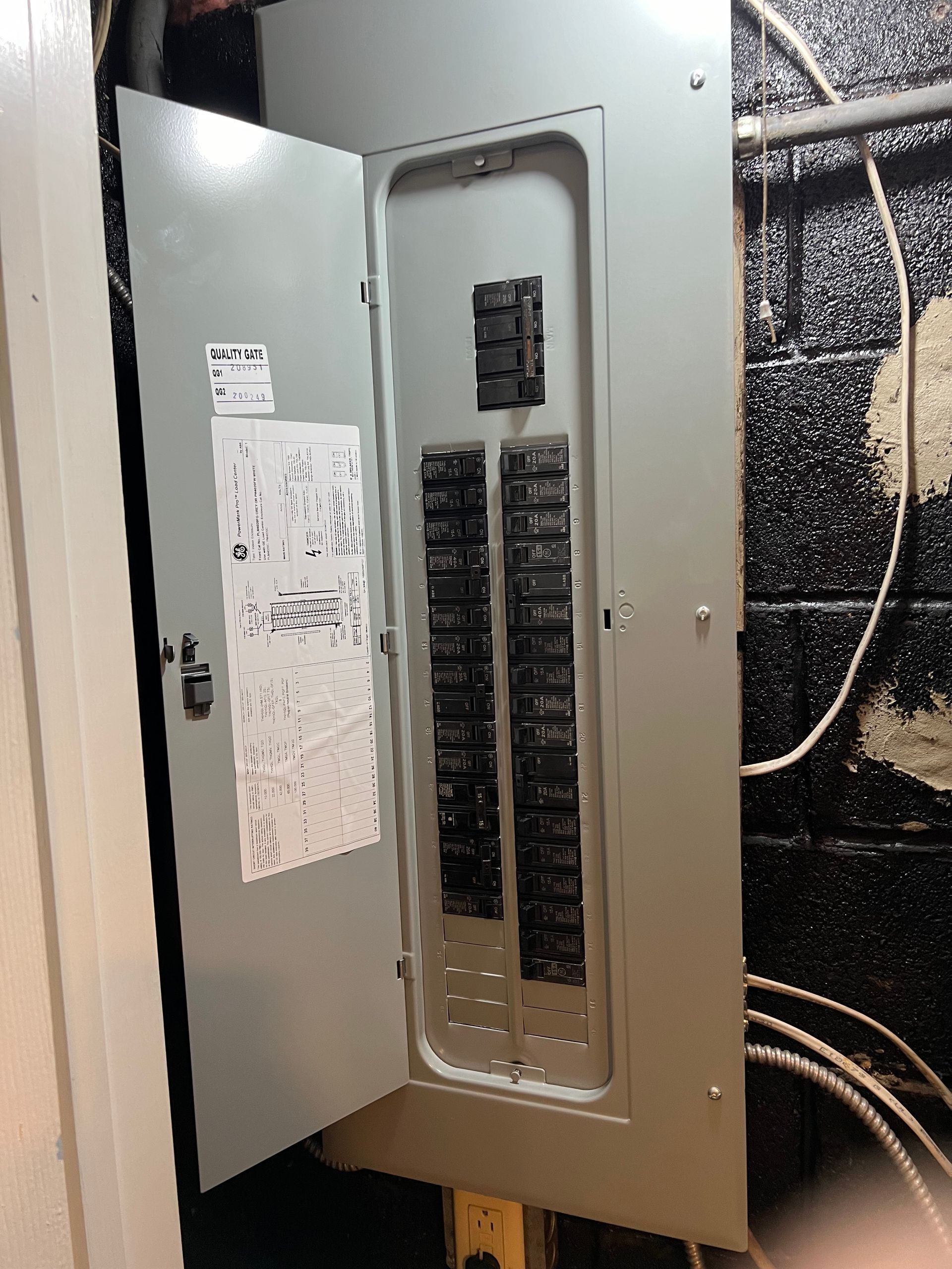 A electrical box with the door open in a room.