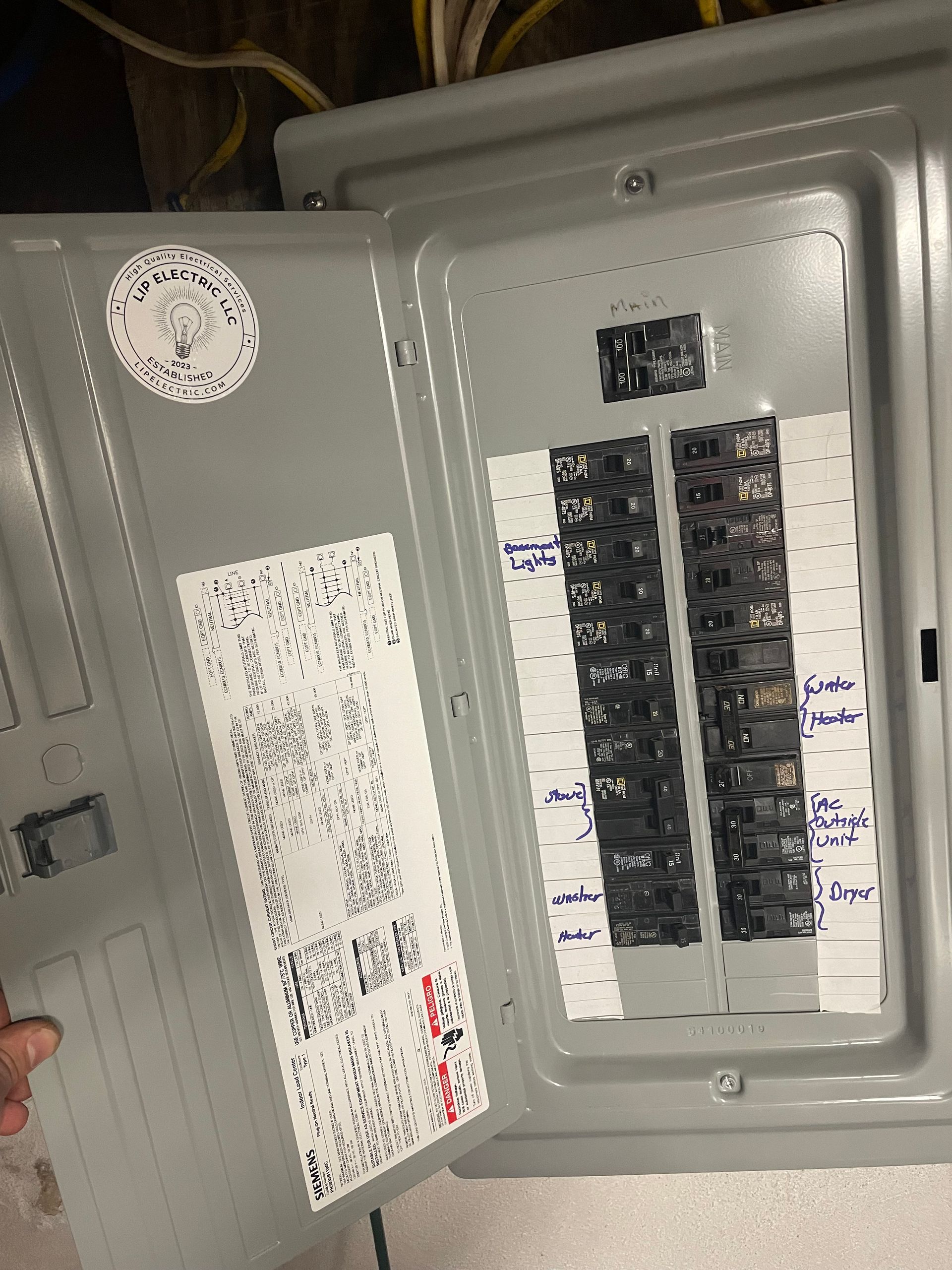 A close up of a electrical box with labels on it.