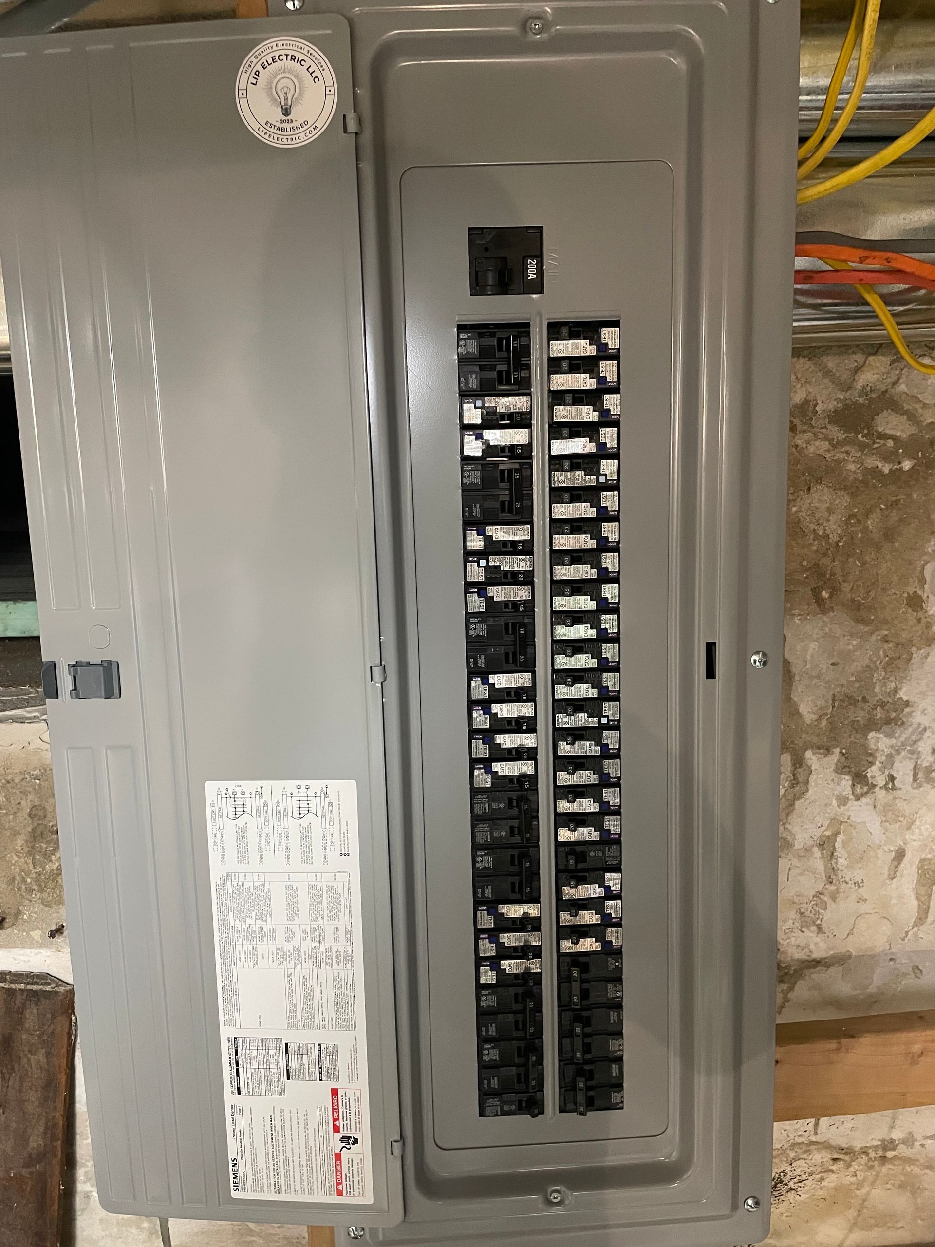 A close up of a electrical box on a wall.