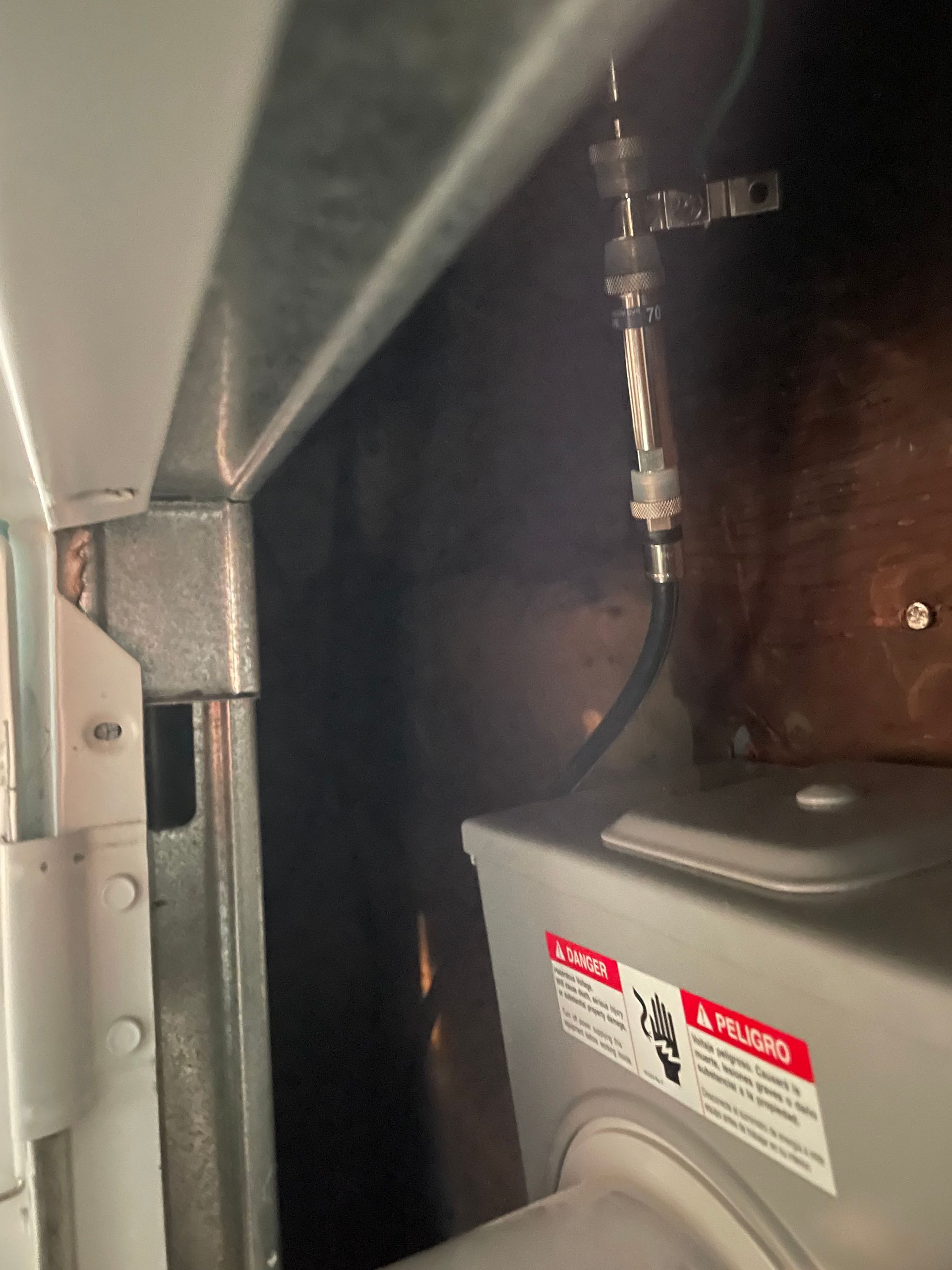 A washer and dryer with a warning label on it