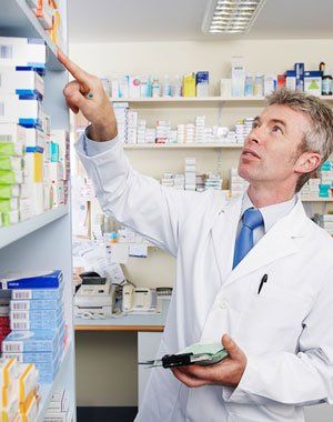 Pharmacist searching for a medicine