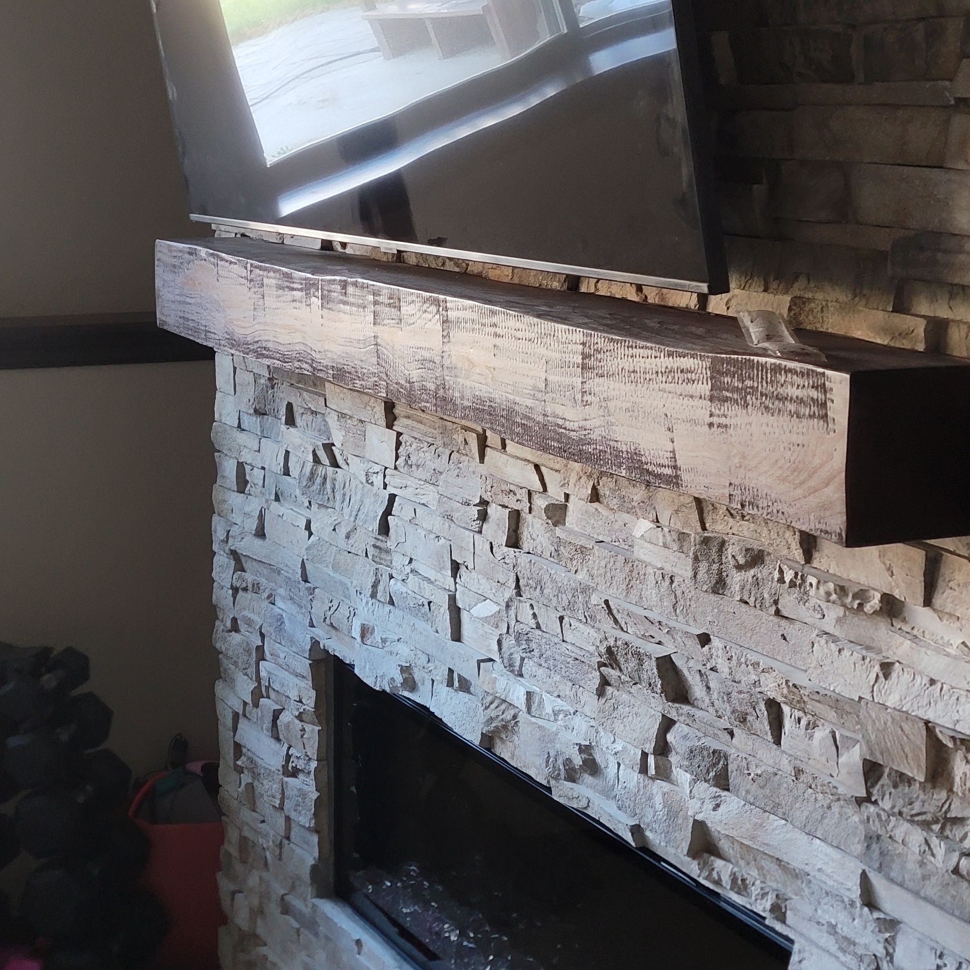 A fireplace with a mirror on top of it