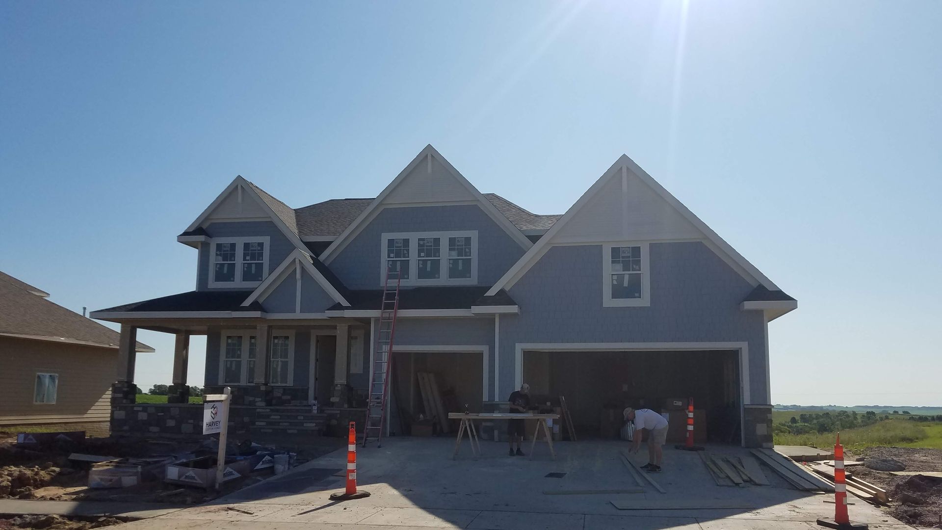 A large house is being built in a residential area.