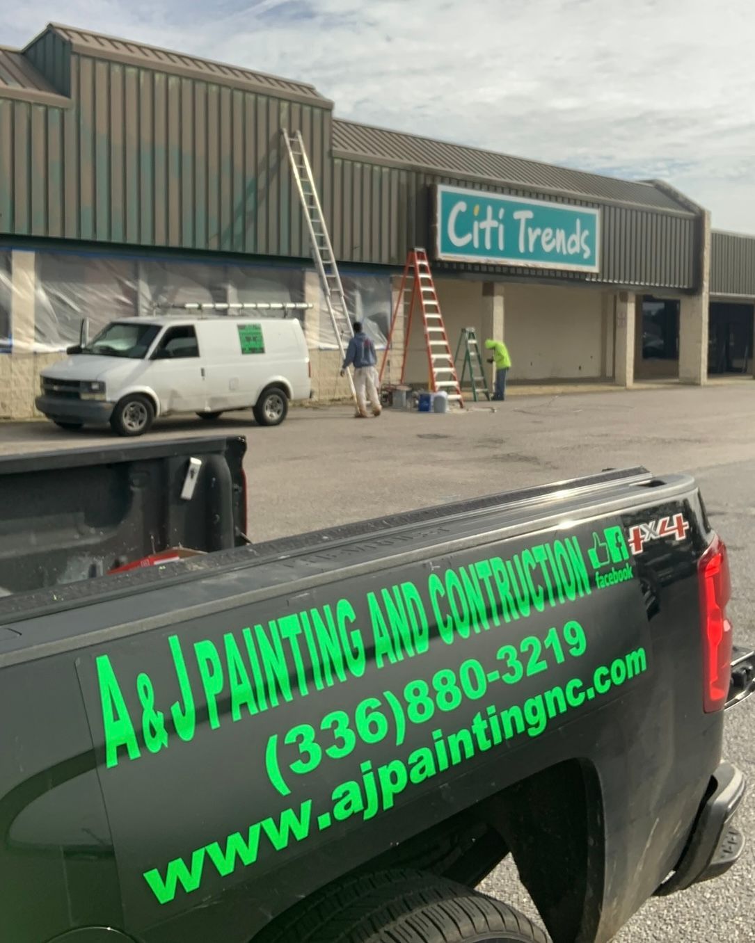 A truck is parked in front of a building that says Citi Trends