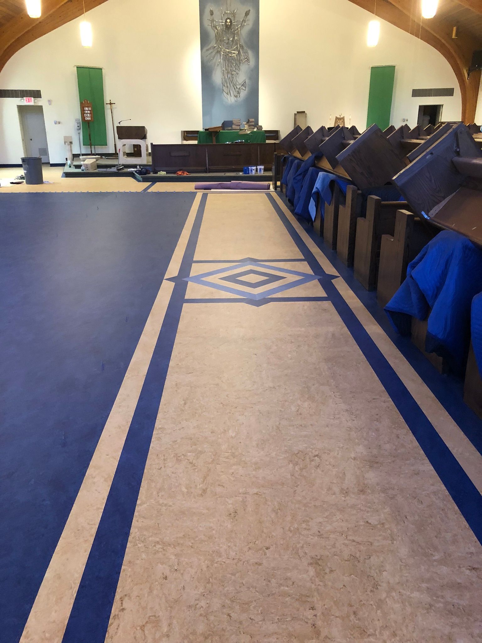 A church with a blue and white carpeted floor