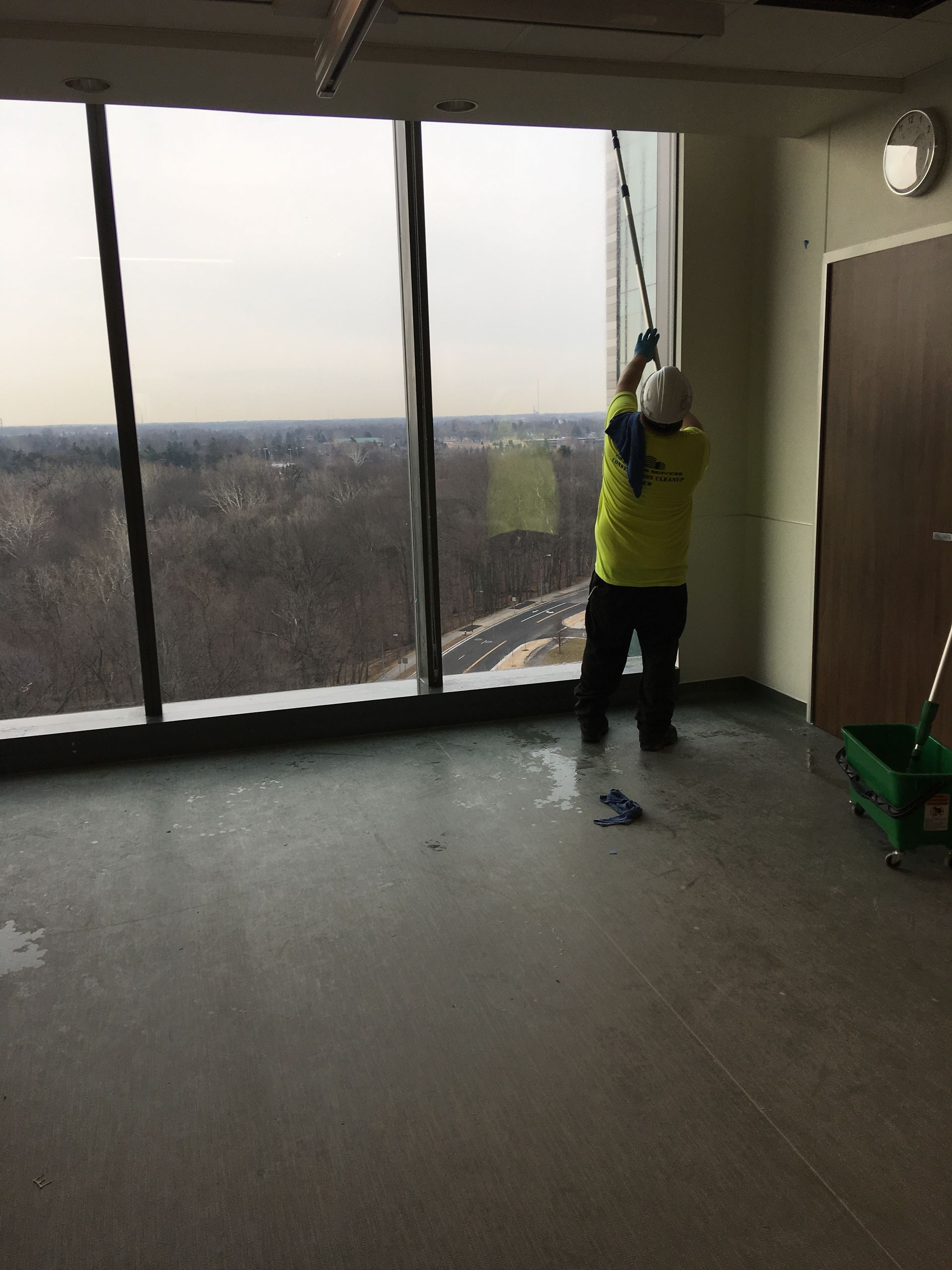 A man is cleaning a window