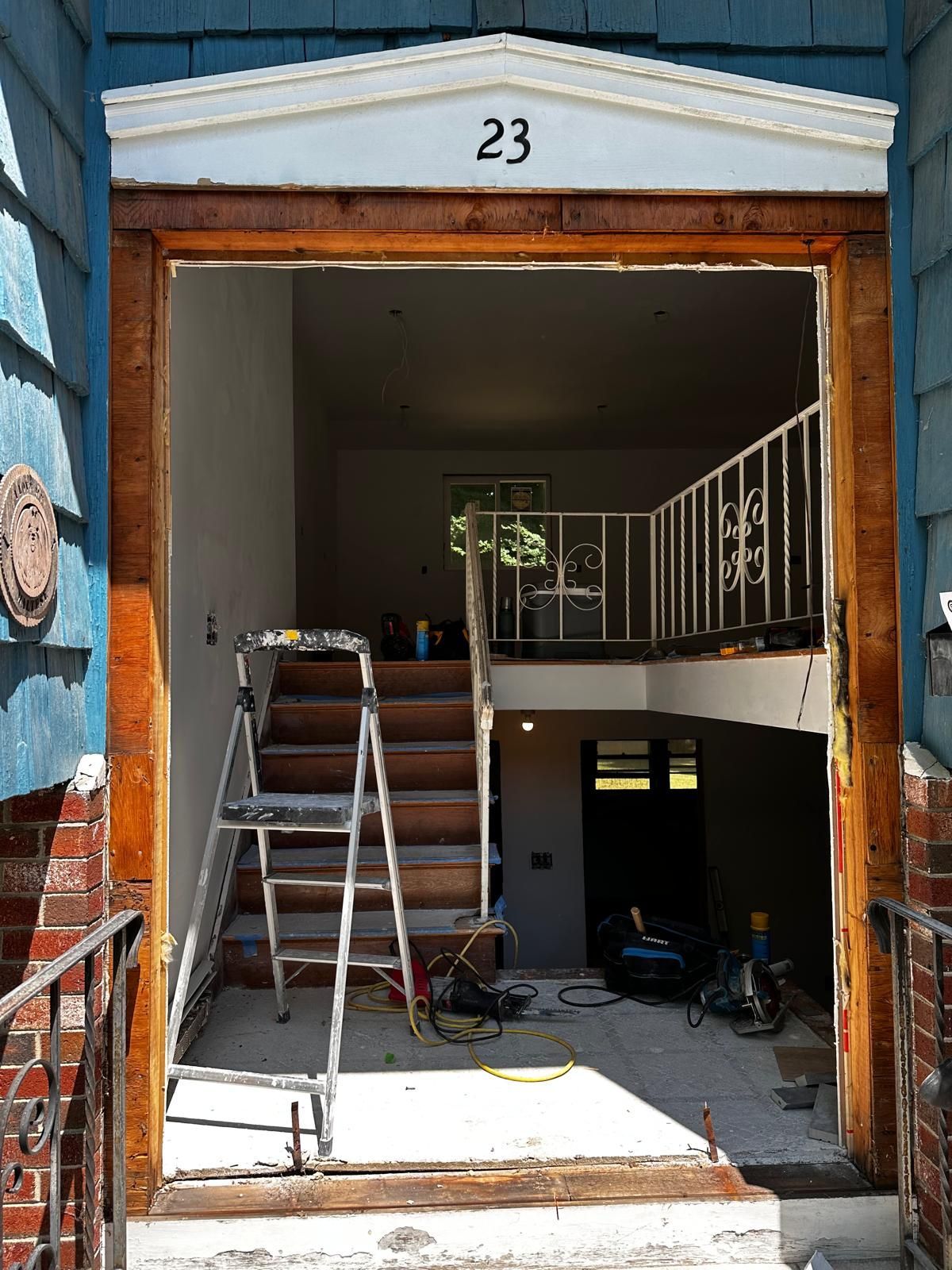 The number 23 is on the door of a house