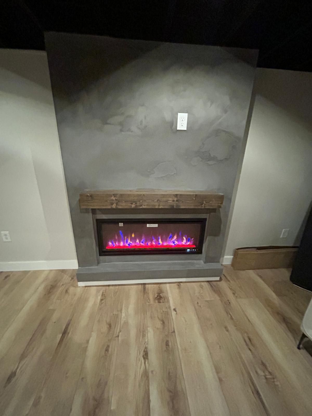 There is a fireplace in the middle of the room.