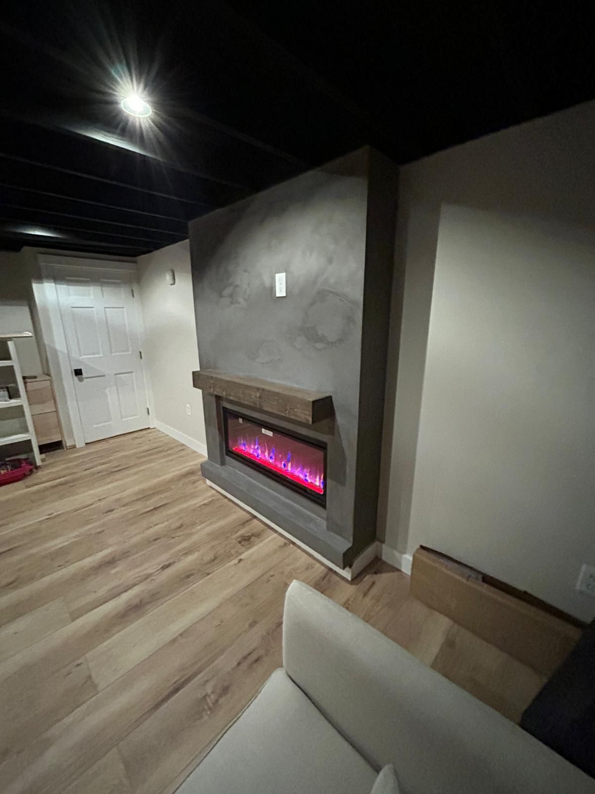 A living room with a fireplace and a couch.