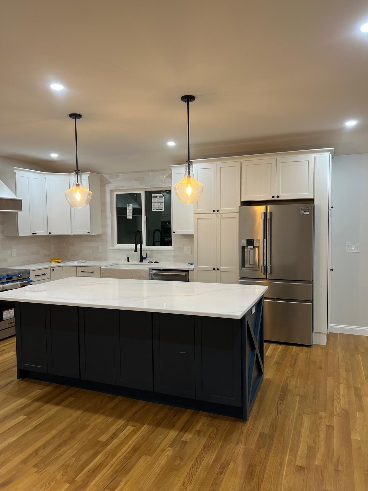 A kitchen with a large island in the middle of it.