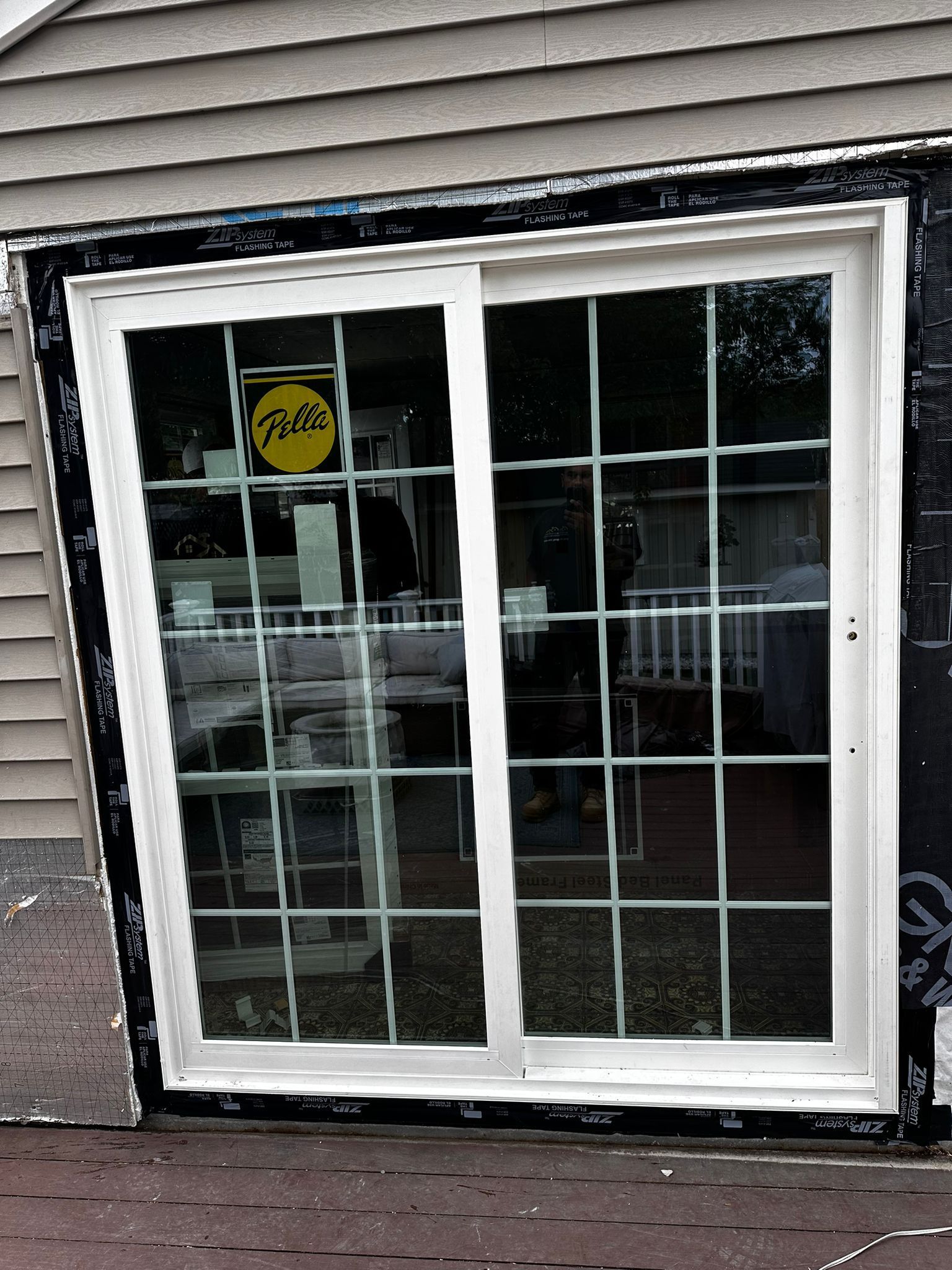 A sliding glass door with a yale sign on it