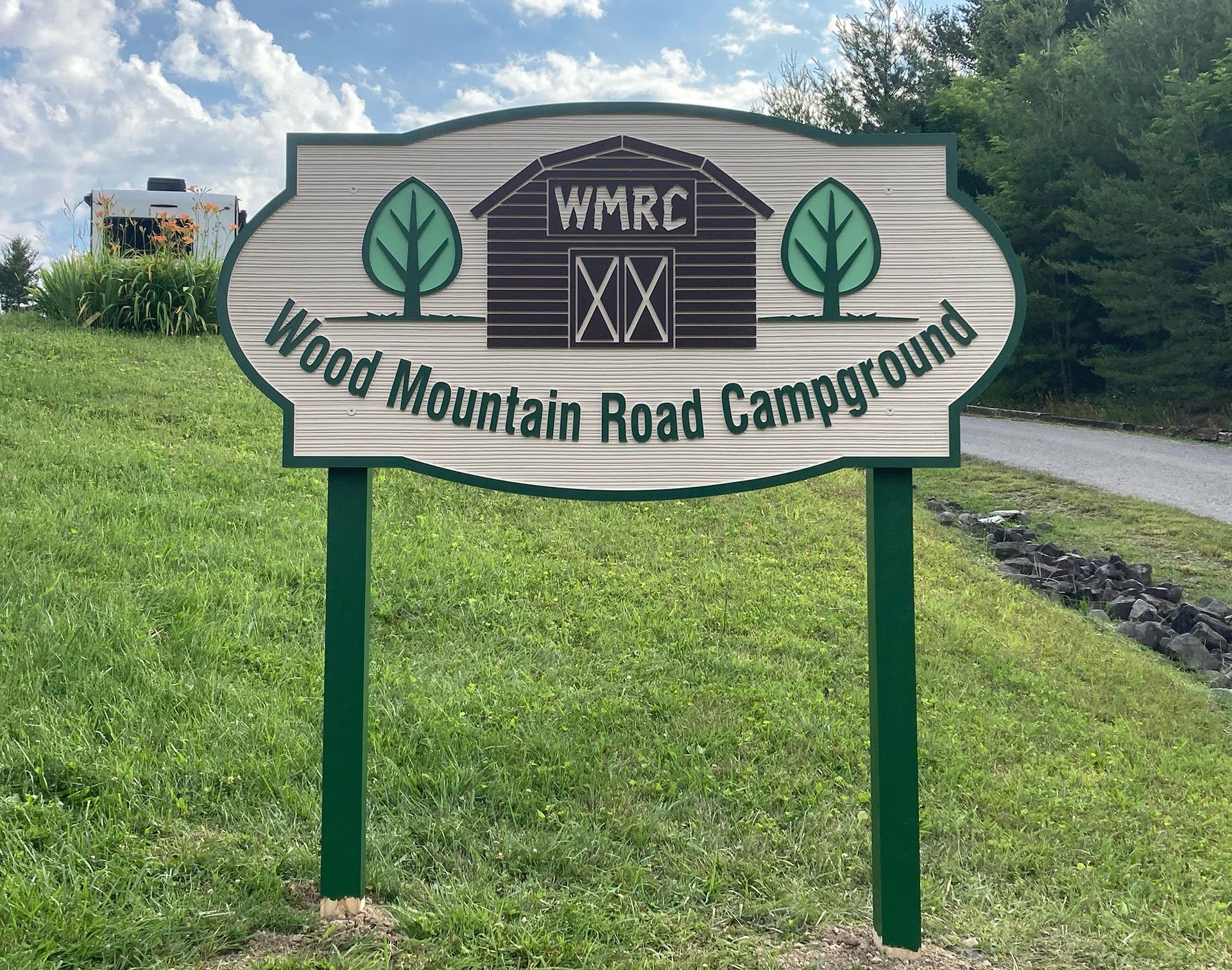 A sign that says Wood Mountain Road Campground on it