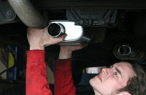 Man fixing New muffler