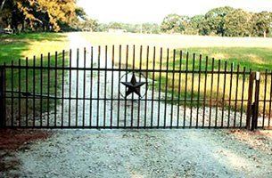 A wrought iron gate with a star in the middle of it