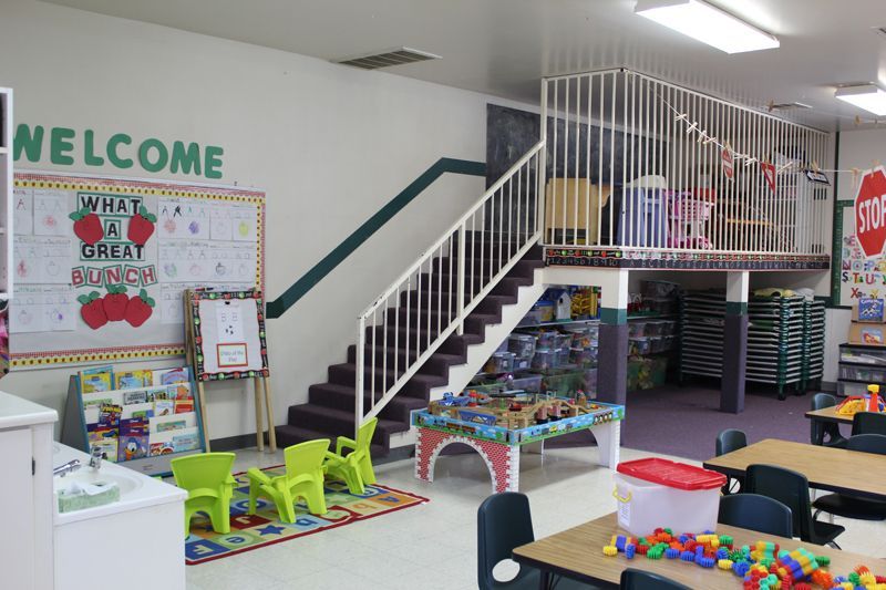 A classroom with a welcome sign on the wall