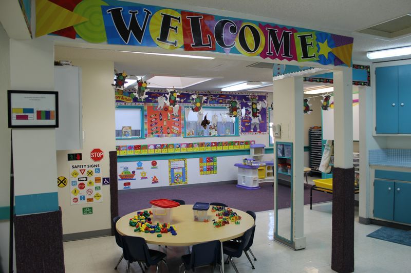 A classroom with a welcome sign above it