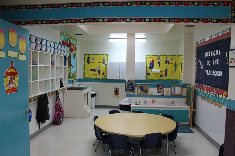 A classroom with a sign that says welcome to the time room