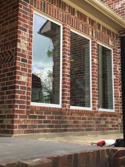 A brick building with a lot of windows on it