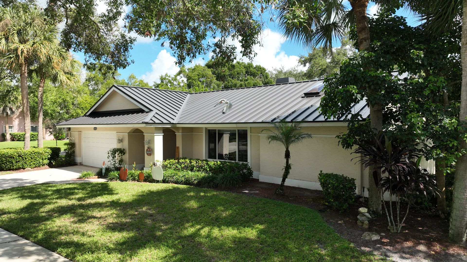 Dark bronze standing seam metal roof installed by Joe Ward Roofing in The Shores of Jupiter, Florida