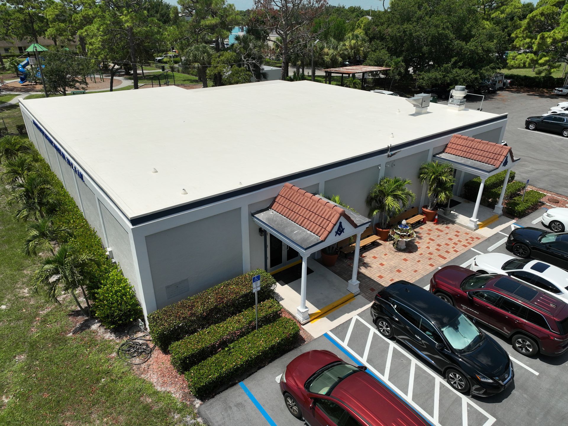 Commercial flat roof replacement project featuring a new FiberTite roofing system in Jupiter, FL