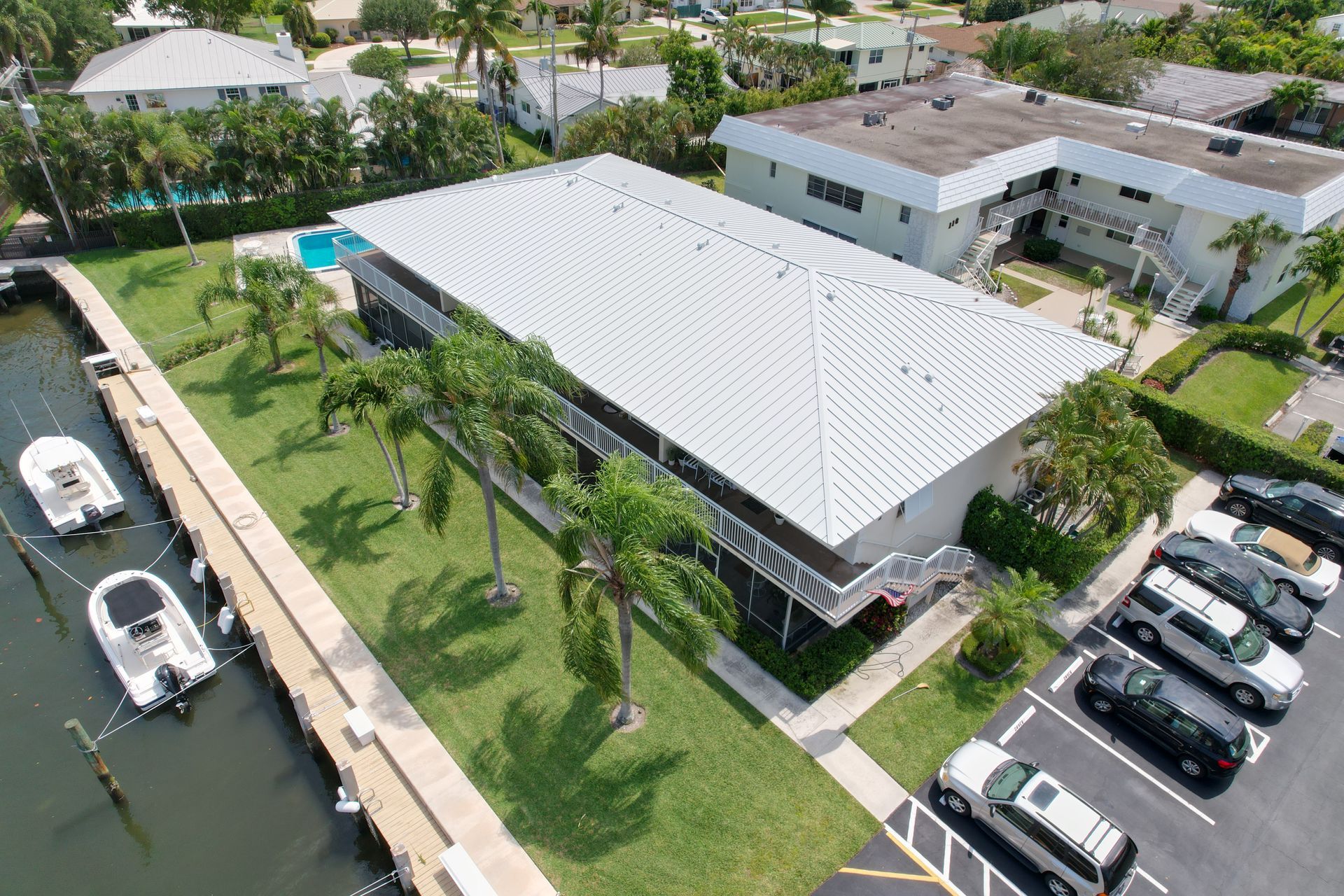North Palm Beach waterfront home with Mist Gray standing seam aluminum metal roof installed 