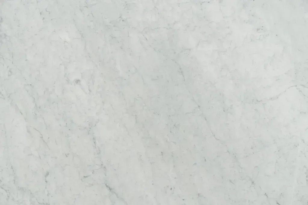 Light gray marbled surface with subtle veining and a faint textured pattern.