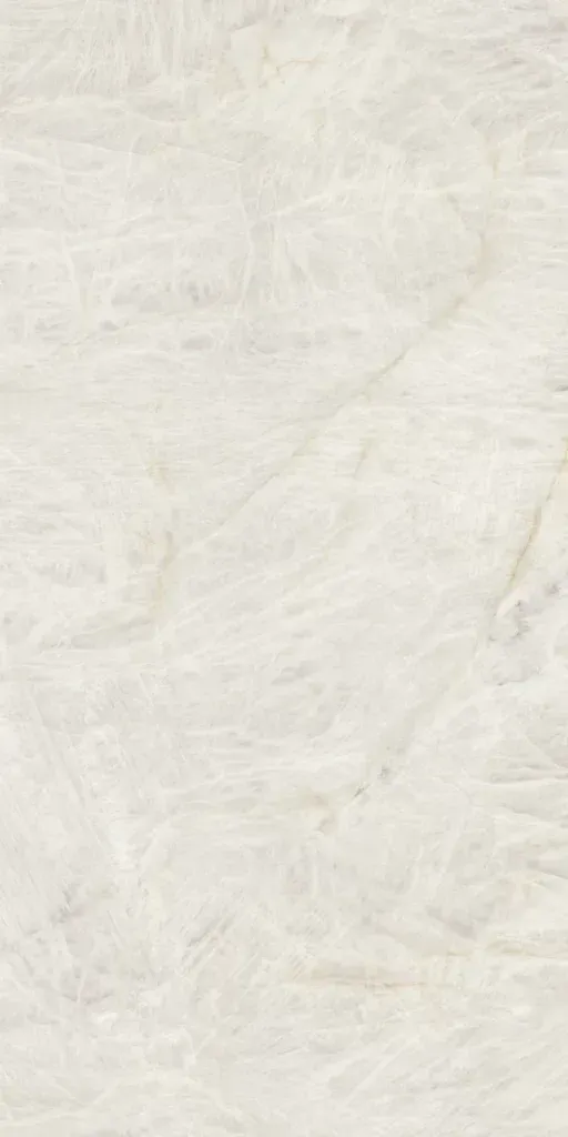 Close-up of a white textured fabric or paper surface with subtle folds and wrinkles