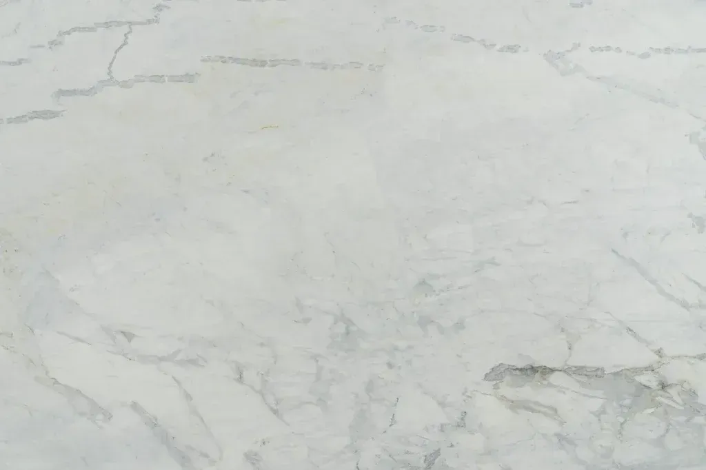 Light gray marble surface with subtle white and darker gray veining