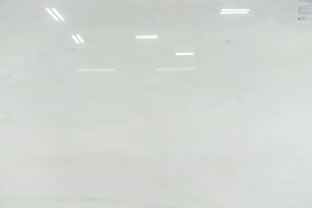 Whiteboard with faint reflections of overhead lights