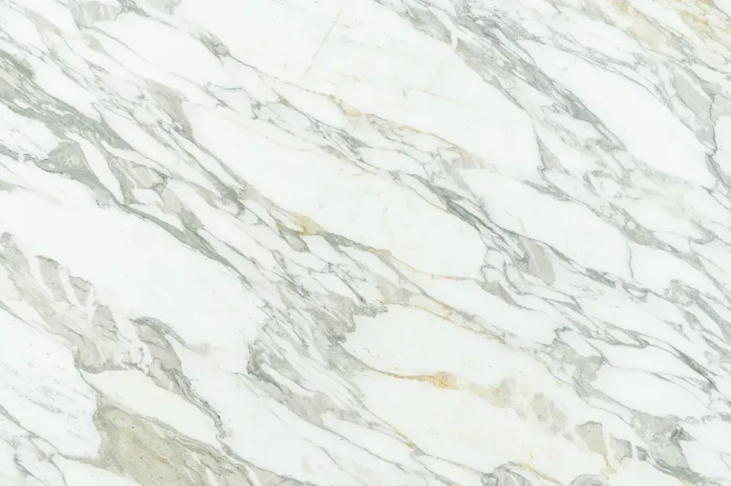 White marble surface with gray and gold veining