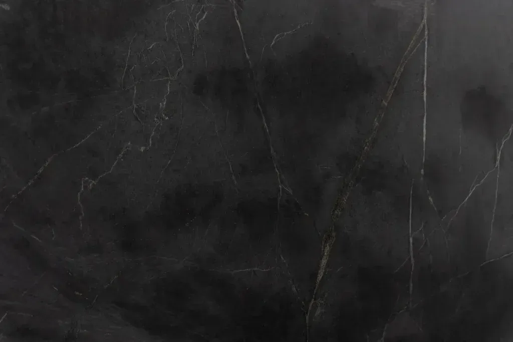 Dark gray marbled stone texture with subtle white veining