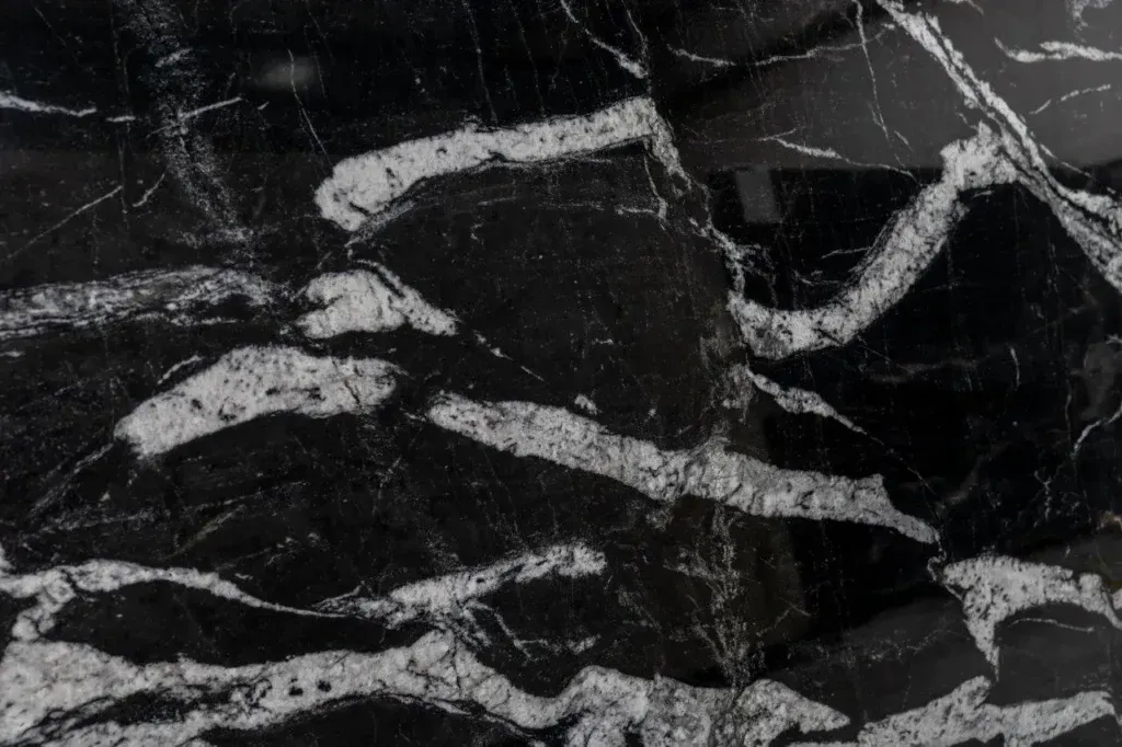 Black marble texture with white veining