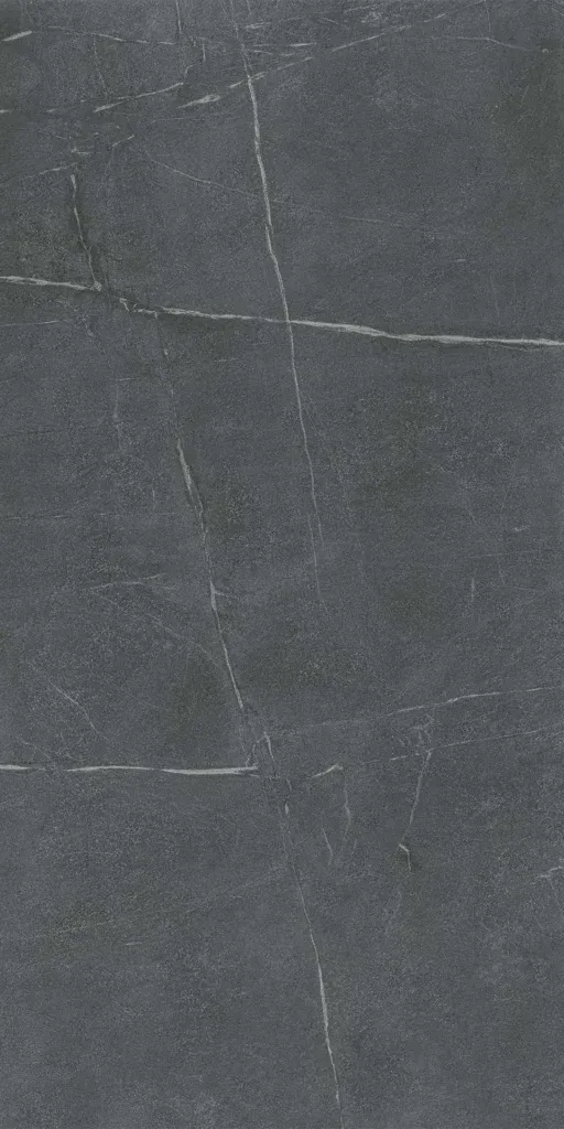 Dark gray stone surface with thin white cracks and subtle texture