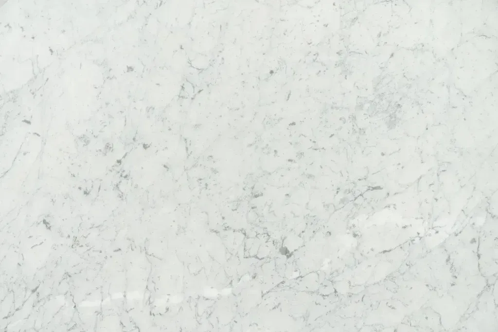 Light gray marble surface with subtle white veining and faint speckles